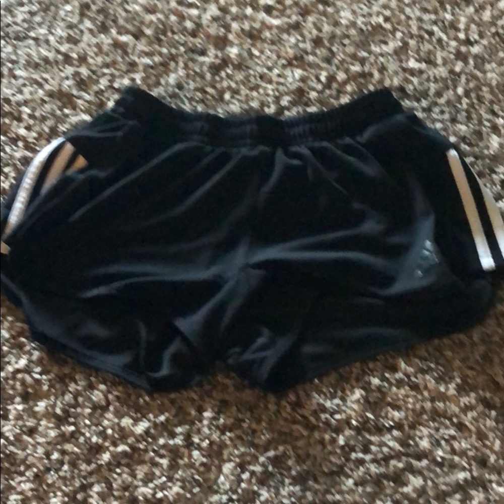 Black adidas pants with 3 stripes